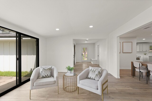 5302 Wigton Dr, Houston, TX 77096 - living area with light wood-style flooring and recessed lighting