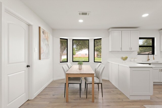 5302 Wigton Dr, Houston, TX 77096 - dining space featuring recessed lighting and light wood-type flooring