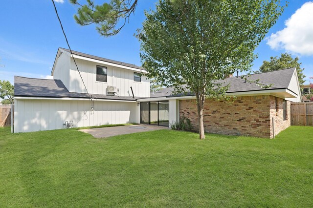 5302 Wigton Dr, Houston, TX 77096 - back of property featuring a patio area, brick siding, and roof with shingles