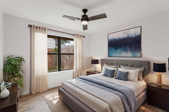 5302 Wigton Dr, Houston, TX 77096 - bedroom with light wood-style floors and a ceiling fan