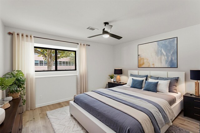 5302 Wigton Dr, Houston, TX 77096 - bedroom featuring light wood-style floors and a ceiling fan