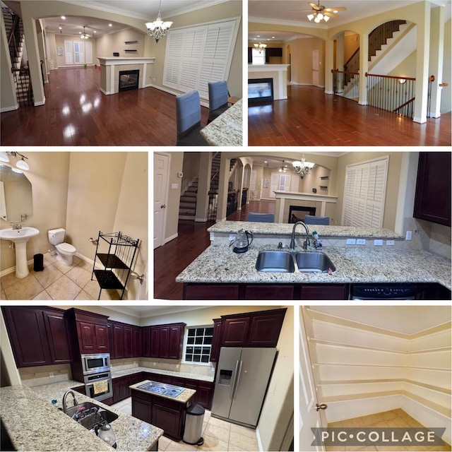 7115 Laguna Villas, Houston, TX 77036 - kitchen featuring a tile fireplace, open floor plan, stainless steel appliances, and ornamental molding