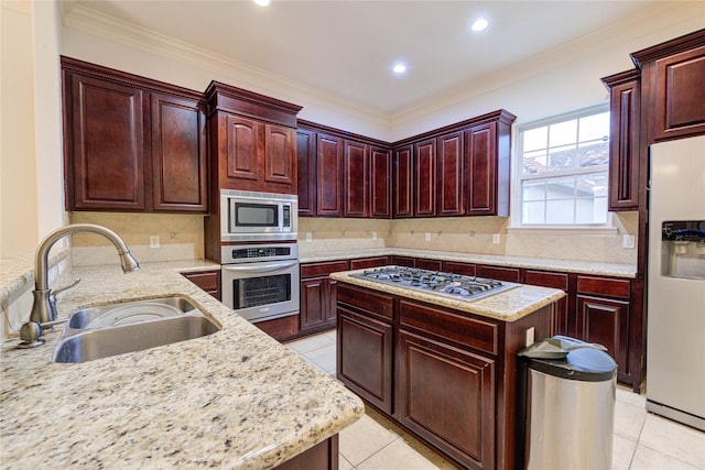 7115 Laguna Villas, Houston, TX 77036 - kitchen featuring stainless steel appliances, light tile patterned floors, decorative backsplash, light stone countertops, and ornamental molding