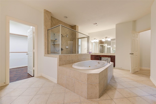 7115 Laguna Villas, Houston, TX 77036 - full bathroom with a shower stall, tile patterned floors, a tub with jets, and vanity