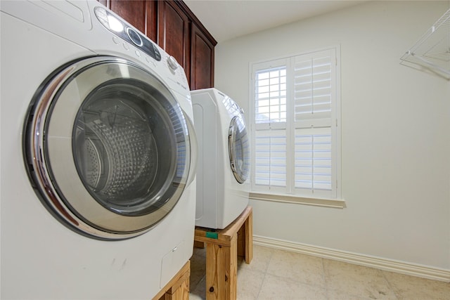 7115 Laguna Villas, Houston, TX 77036 - laundry area with cabinet space and washer and dryer