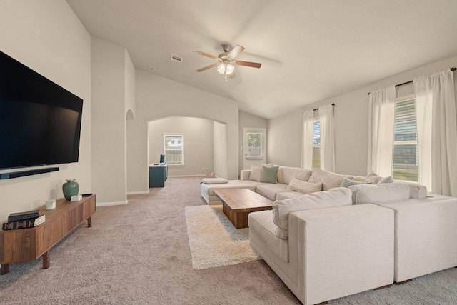 19110 Macallan Ln, Katy, TX 77449 - living area featuring arched walkways, ceiling fan, carpet flooring, and vaulted ceiling