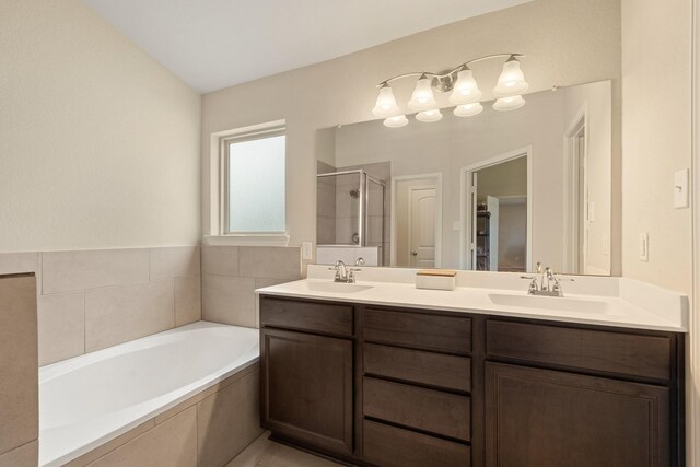 19110 Macallan Ln, Katy, TX 77449 - full bathroom featuring a shower stall, double vanity, and a bath