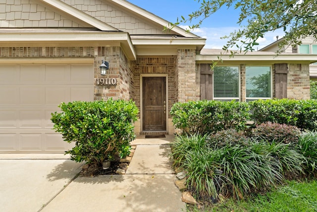 19110 Macallan Ln, Katy, TX 77449 - entrance to property with a garage and brick siding