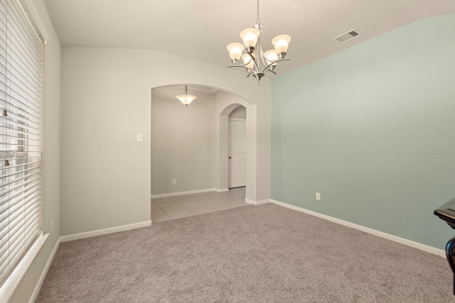 19110 Macallan Ln, Katy, TX 77449 - unfurnished room featuring arched walkways, light colored carpet, vaulted ceiling, a chandelier, and plenty of natural light