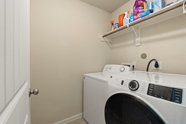 19110 Macallan Ln, Katy, TX 77449 - laundry area with independent washer and dryer and baseboards