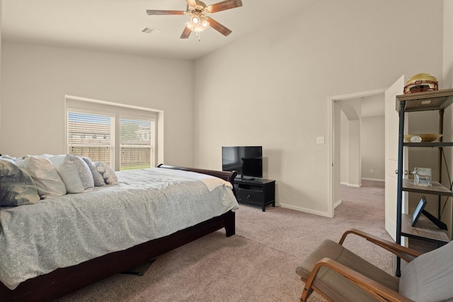 19110 Macallan Ln, Katy, TX 77449 - bedroom with light carpet, lofted ceiling, a ceiling fan, and arched walkways