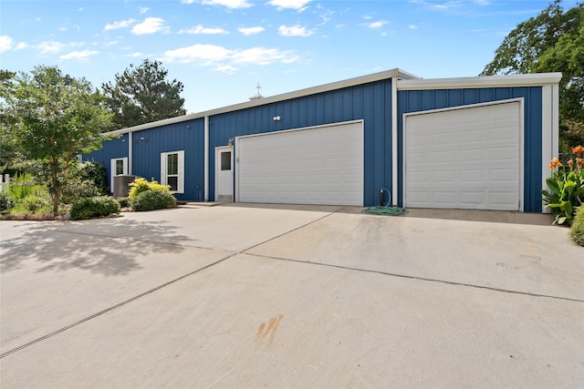 25460 W Fm 1097th Rd, Montgomery, TX 77356 - view of front of property with board and batten siding and a detached garage