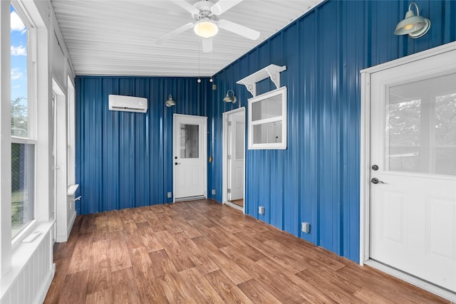 25460 W Fm 1097th Rd, Montgomery, TX 77356 - unfurnished sunroom featuring a wall unit AC and plenty of natural light