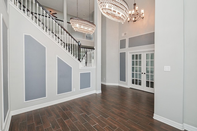 16210 S Temple Dr, Houston, TX 77095 - foyer entrance with a chandelier, a high ceiling, dark wood-style floors, french doors, and stairs