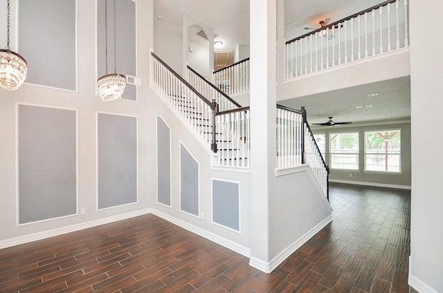 16210 S Temple Dr, Houston, TX 77095 - staircase featuring a chandelier, a high ceiling, wood tiled floors, and ceiling fan