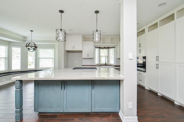 16210 S Temple Dr, Houston, TX 77095 - kitchen featuring oven, dark wood-style floors, white cabinets, light stone counters, and healthy amount of natural light