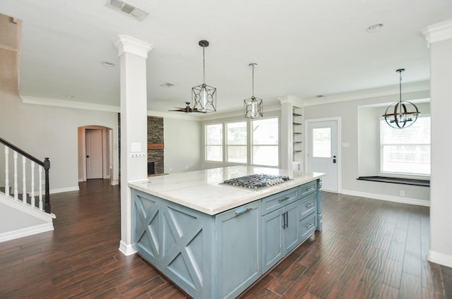 16210 S Temple Dr, Houston, TX 77095 - kitchen with stainless steel gas cooktop, ornamental molding, dark wood-style floors, pendant lighting, and a chandelier
