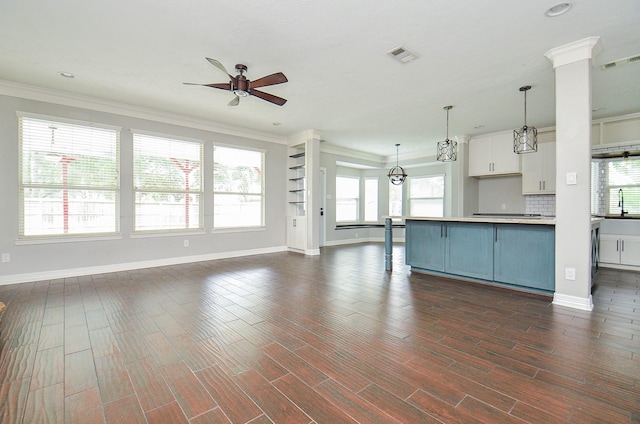 16210 S Temple Dr, Houston, TX 77095 - kitchen with open floor plan, ceiling fan, pendant lighting, crown molding, and dark wood-style flooring