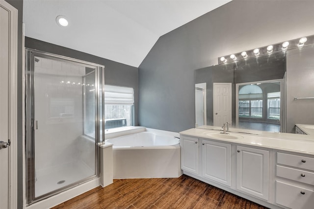 1431 Hidden Terrace Dr, Sugar Land, TX 77479 - full bath featuring vanity, a bath, a stall shower, vaulted ceiling, and wood finished floors