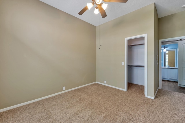 1431 Hidden Terrace Dr, Sugar Land, TX 77479 - unfurnished bedroom featuring carpet, a spacious closet, vaulted ceiling, a closet, and ceiling fan