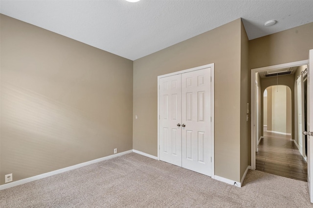 1431 Hidden Terrace Dr, Sugar Land, TX 77479 - unfurnished bedroom featuring attic access, carpet flooring, and a closet