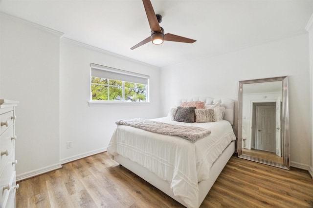 1215 Heathwood Dr, Houston, TX 77077 - bedroom with wood finished floors, ornamental molding, and a ceiling fan