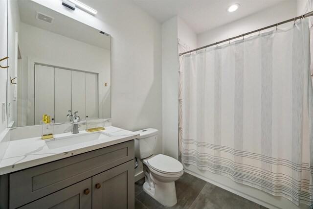 1215 Heathwood Dr, Houston, TX 77077 - full bathroom featuring vanity, shower / bathtub combination with curtain, and recessed lighting