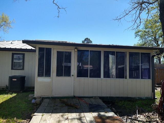 3661 Fm 3277, Livingston, TX 77351 - back of house featuring a metal roof and a sunroom