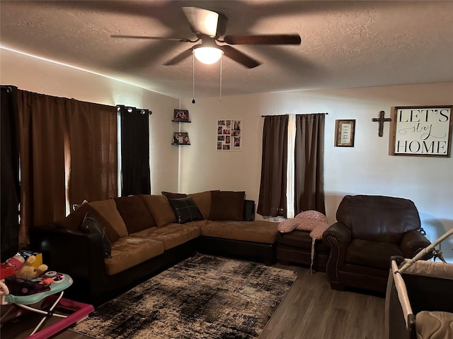3661 Fm 3277, Livingston, TX 77351 - living room featuring wood finished floors, ceiling fan, and a textured ceiling