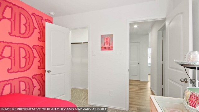 5446 Pinetree Crescent Ln, Spring, TX 77373 - bedroom with a closet and wood finished floors