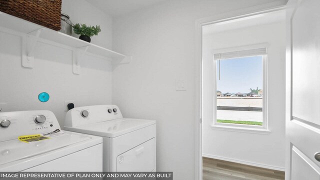 5446 Pinetree Crescent Ln, Spring, TX 77373 - washroom featuring washer and dryer, light wood-style flooring, and healthy amount of natural light