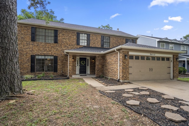 8415 Sparkling Springs Dr, Houston, TX 77095 - view of front of home featuring an attached garage, concrete driveway, brick siding, and roof with shingles