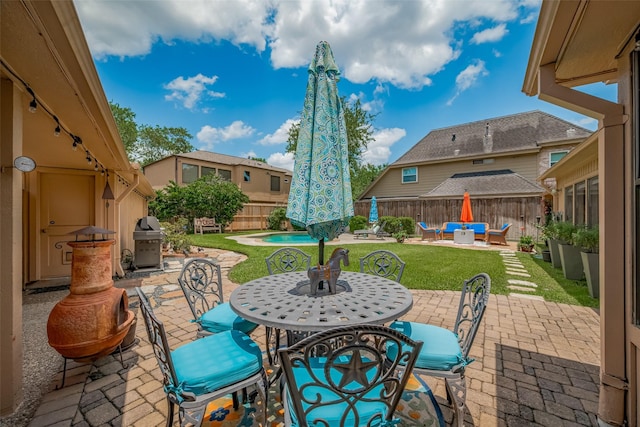 12214 Clearfork Dr, Houston, TX 77077 - fenced backyard featuring an outdoor living space, a patio, a grill, and outdoor dining area
