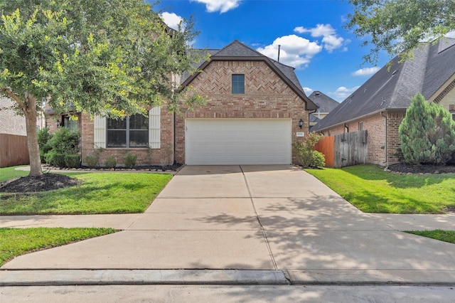 4511 Hickory Branch Ln, Sugar Land, TX 77479 - view of front of home featuring brick siding, driveway, and an attached garage