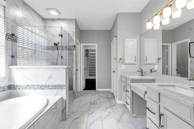 4511 Hickory Branch Ln, Sugar Land, TX 77479 - bathroom with a marble finish shower, double vanity, a garden tub, marble finish floors, and a spacious closet