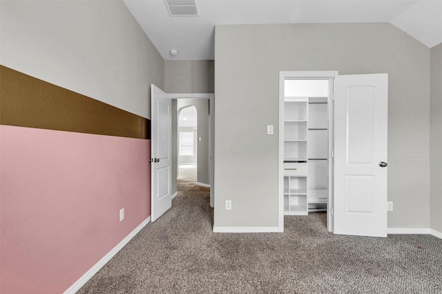 4511 Hickory Branch Ln, Sugar Land, TX 77479 - unfurnished bedroom featuring carpet flooring, a spacious closet, arched walkways, and lofted ceiling