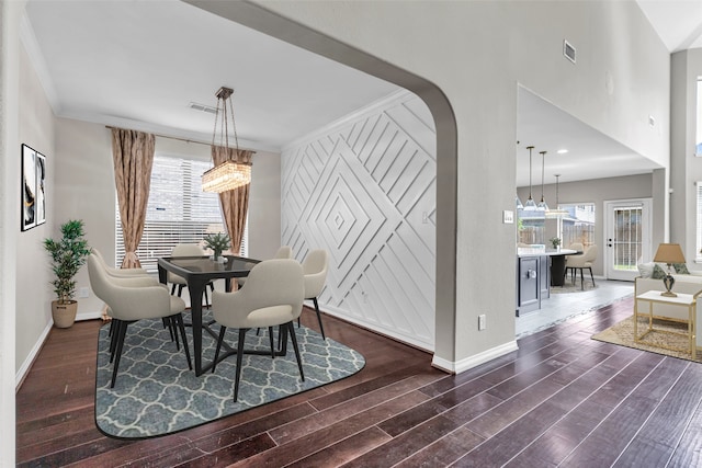 4511 Hickory Branch Ln, Sugar Land, TX 77479 - dining area with dark wood-style flooring and arched walkways