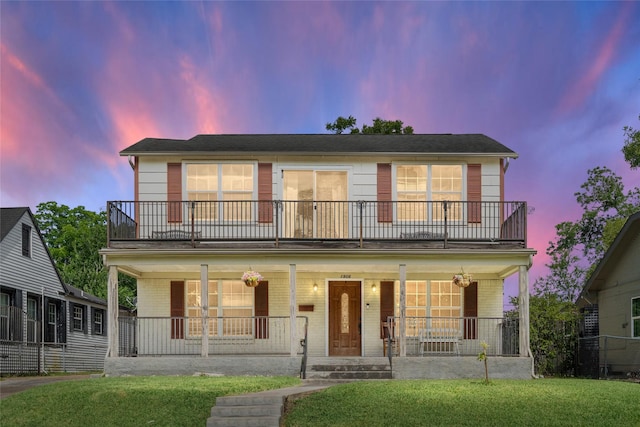 1906 Pasadena St, Houston, TX 77023 - view of front of home featuring a balcony, covered porch, and a front yard