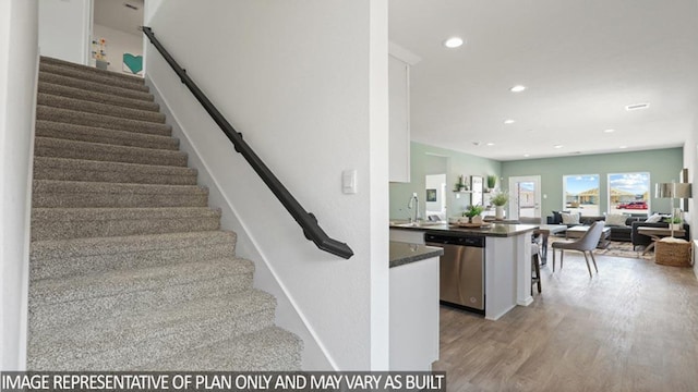 5442 Pinetree Crescent Ln, Spring, TX 77373 - stairway featuring wood finished floors and recessed lighting