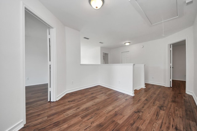 9226 Wichita Dr, La Porte, TX 77571 - unfurnished room with attic access and dark wood-style flooring