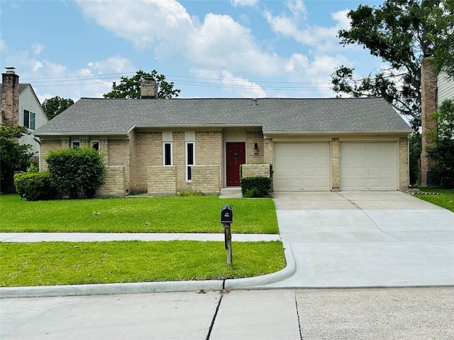 15474 Peermont St, Houston, TX 77062 - view of front of property with a garage, driveway, a front yard, brick siding, and a chimney