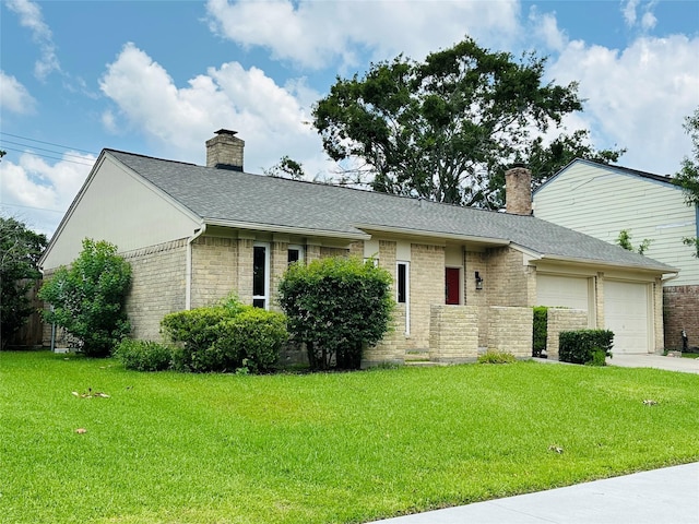 15474 Peermont St, Houston, TX 77062 - view of front of home with a chimney, an attached garage, and a front lawn