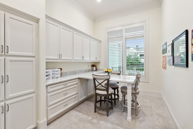 5201 Pine St, Bellaire, TX 77401 - dining space featuring ornamental molding and baseboards