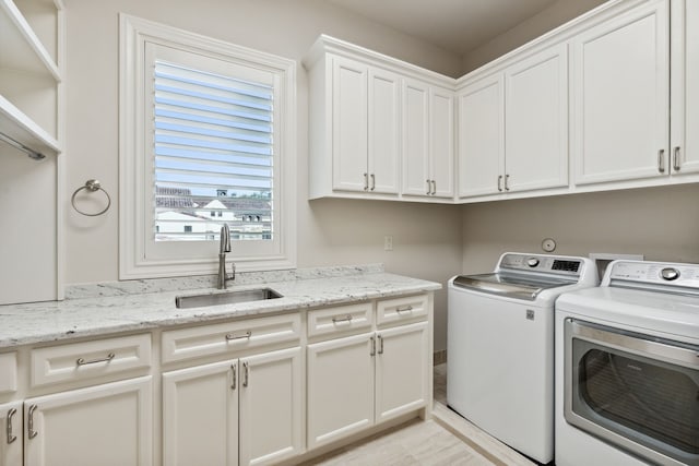 5201 Pine St, Bellaire, TX 77401 - washroom featuring washer and clothes dryer and cabinet space