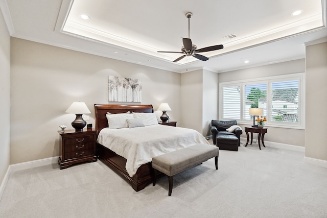5201 Pine St, Bellaire, TX 77401 - bedroom featuring a tray ceiling, light colored carpet, crown molding, recessed lighting, and ceiling fan