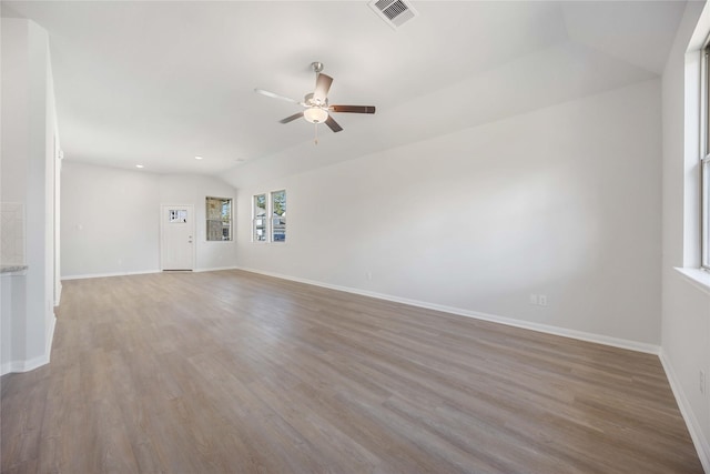 10919 Independence Rd, Cleveland, TX 77328 - spare room featuring a ceiling fan, wood finished floors, vaulted ceiling, and recessed lighting
