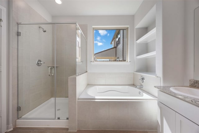 10919 Independence Rd, Cleveland, TX 77328 - bathroom with a garden tub, a stall shower, and vanity