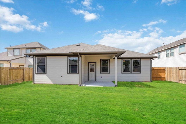 10919 Independence Rd, Cleveland, TX 77328 - rear view of house featuring a patio area, a fenced backyard, and roof with shingles