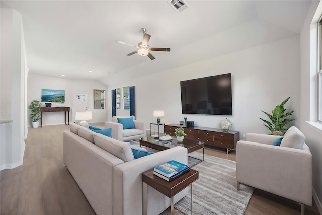 10919 Independence Rd, Cleveland, TX 77328 - living area with wood finished floors, ceiling fan, and lofted ceiling