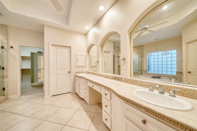 4035 Gramercy St, Houston, TX 77025 - full bath with ceiling fan, double vanity, a bath, a shower stall, and tile patterned floors